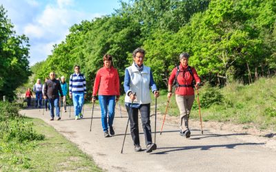 Nordic walkers out in the sunshine Kijkduin beach, the Netherlands - May 20, 2017: nordic walkers in a park